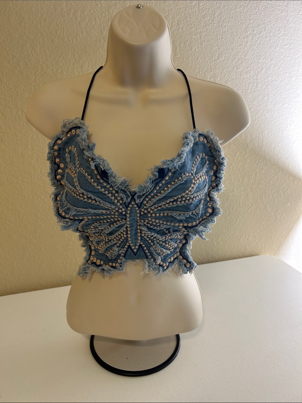 Blue Denim Butterfly Embellished Crop Halter Top
Size One-Size